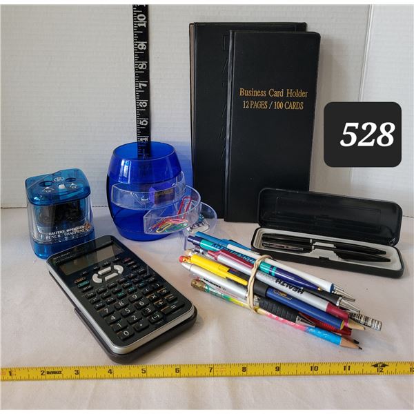 Desk accessories. Sharp calculator, pens, sharpener etc.