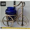 Image 1 : Rattan tricycle with cobalt blue glass flower pot.