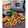 Image 1 : Construction man container filled with related machinery toys.