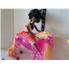 Image 2 : Barbie dolls on horse back.