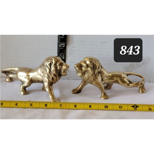 Pair of solid brass lions.