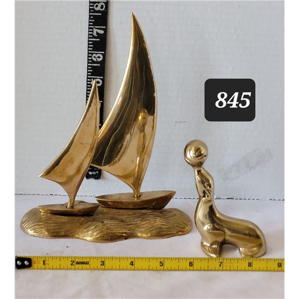 Brass sailboats & seal.