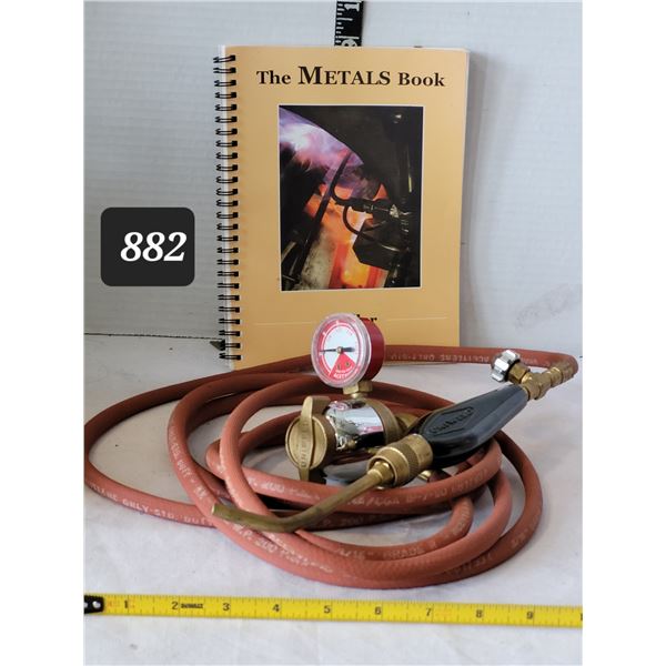 Uniweld torch, acetylene gage & metals book.