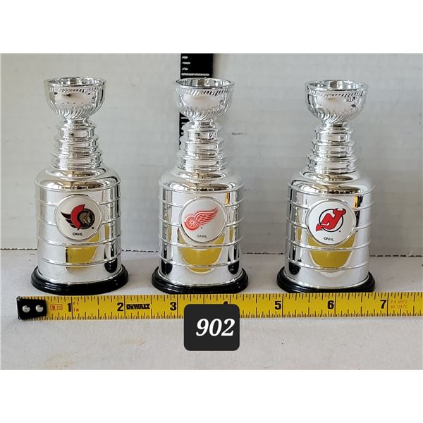 Miniature team logo Stanley Cups.