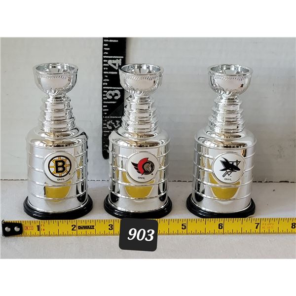 Miniature team logo Stanley Cups.