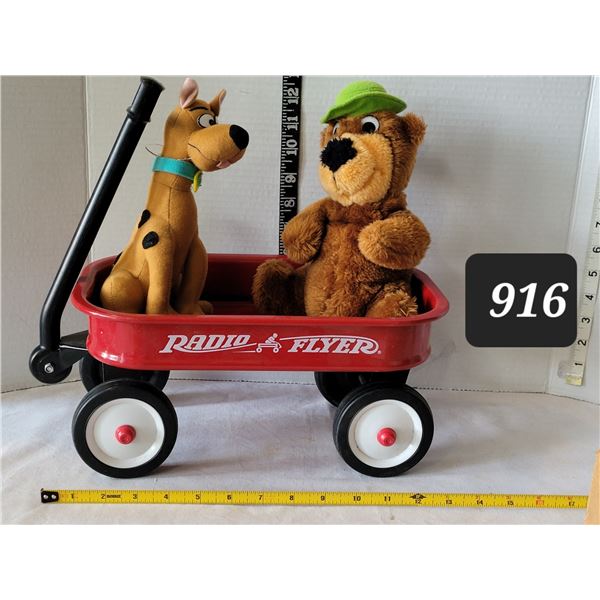 Very small Radio Flyer wagon with plush Scooby-doo & Yogi bear.
