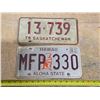 Image 1 : 2 license plates- 1 is sk and 1 is hawaii