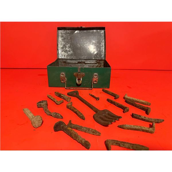 Vintage green metal toolbox collection of rusty, antique hand forged mining nails and a small, metal