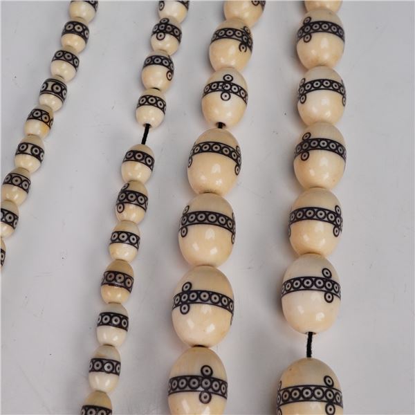 Carved Bone Bead Necklace with Black Inlaid Motifs