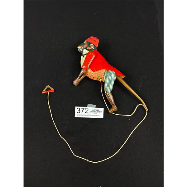 Vintage monkey tin toy