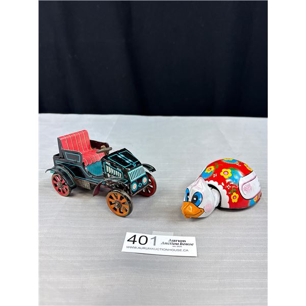 2 Vintage Made in Japan tin toy - Car & Bird
