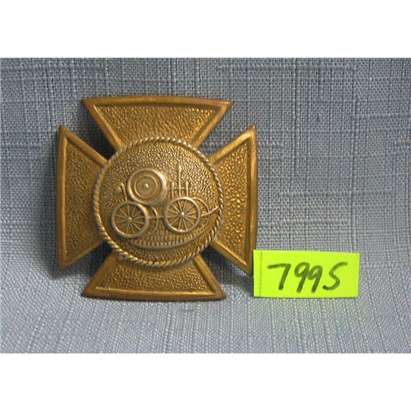 Early horse drawn steam pump badge