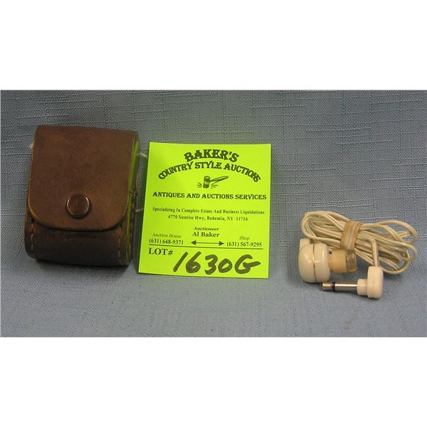 Pair of vintage ear plugs in original leather case