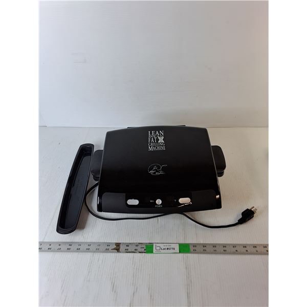 George Foreman Grilling Machine- Powers On
