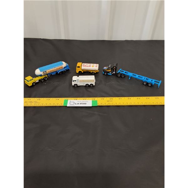 (4) Semi and Tanker Truck Toys