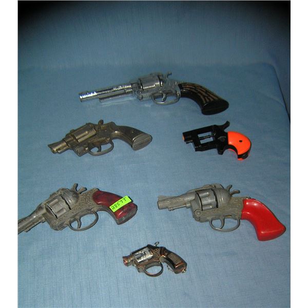 Collection of 6 all cast metal vintage cap guns