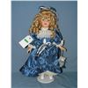 Fancy porcelain doll with silk dress