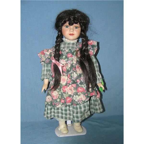 Porcelain doll with pig tails
