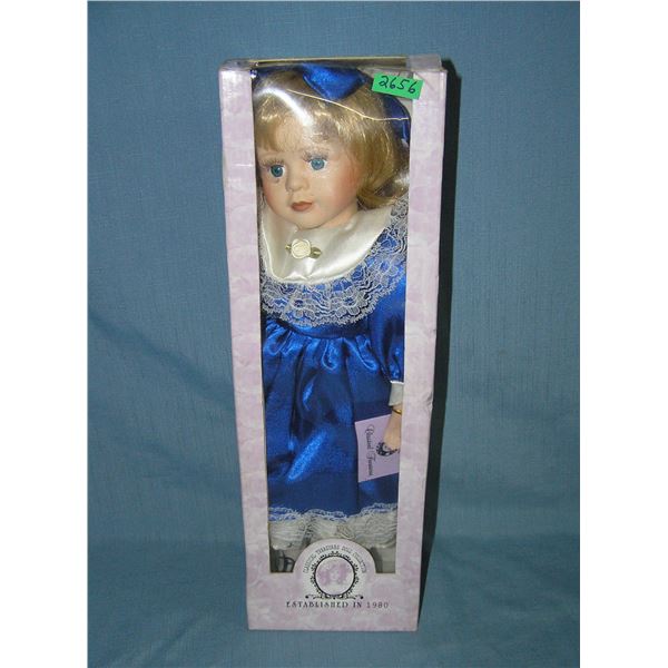 Porcelain doll in fancy blue dress