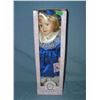 Porcelain doll in fancy blue dress