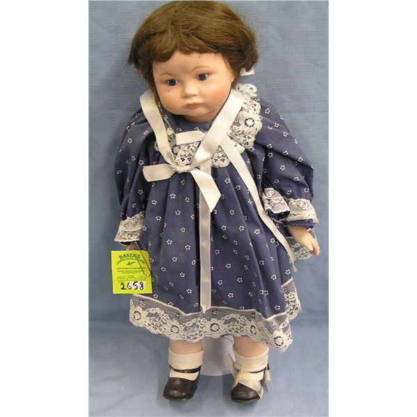Porcelain doll in fancy blue dress