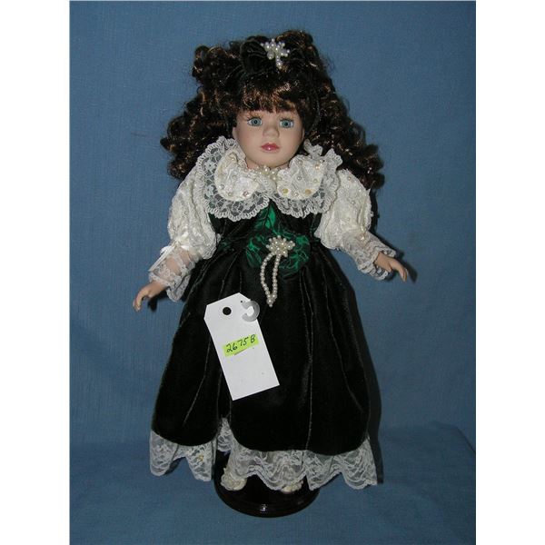 Beatuiful porcelain doll with fancy dress and pearls