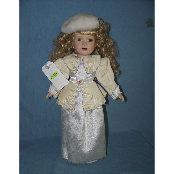 Porcelain windup musical doll in fancy dress