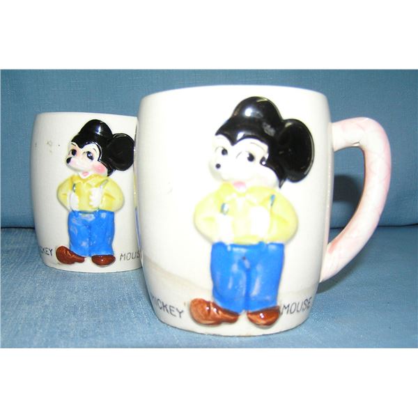 Pair of great early Mickey Mouse milk mugs