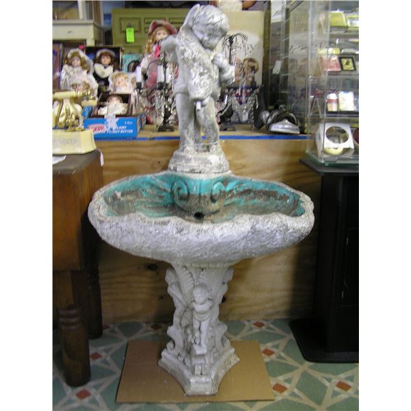 Antique seashell shaped bird bath
