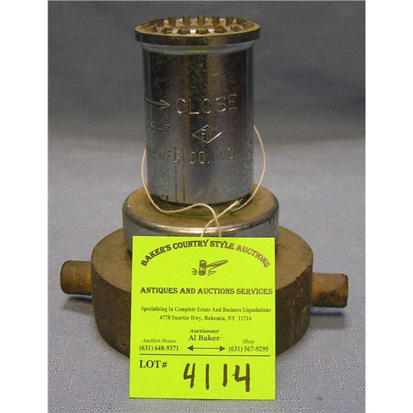 Antique brass fire nozzle by Elkhart brass company