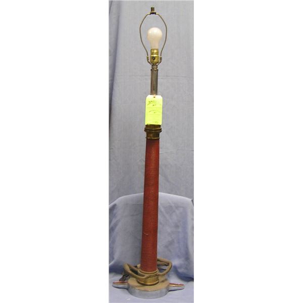 Large antique fire nozzle lamp