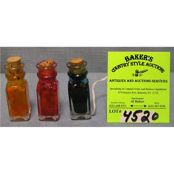 Group of four miniature perfume bottles
