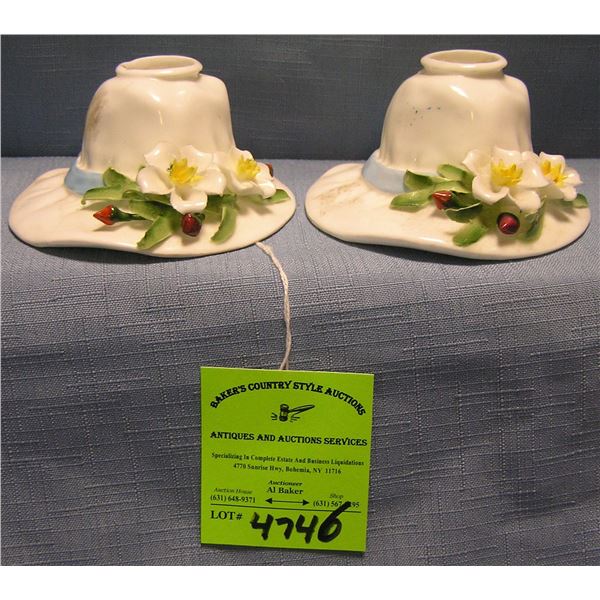 Pair of floral decorated ladies bonnet shaped candle stick