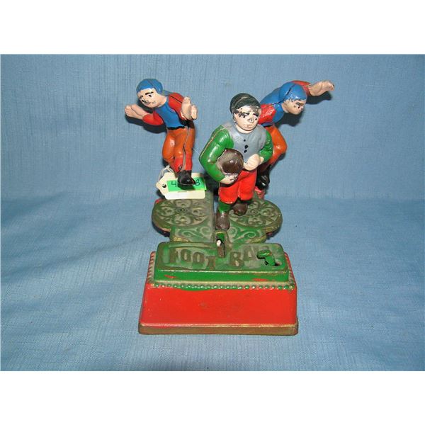 Calamity the football bank cast iron mechanical bank