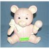 Image 1 : Seated bear bank with ribbon and rattle by Enesco