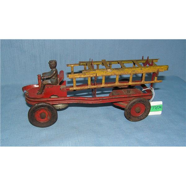 Early all tin fire ladder truck with ringing bell