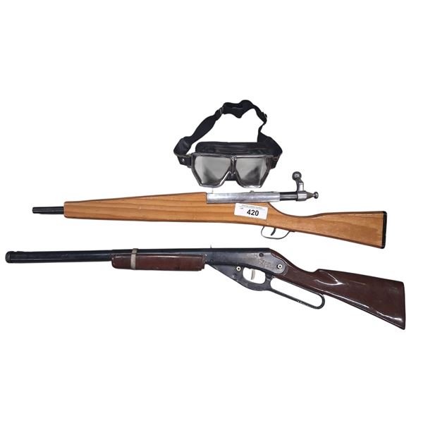 Pair of toy guns and pair of goggles