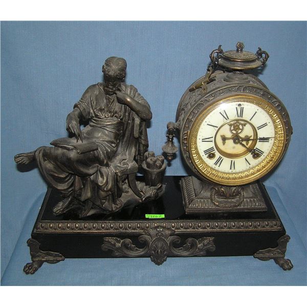Bronzed over cast metal mantle clock with Cincinnatus figure