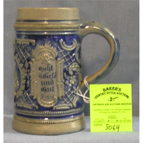 Vintage German beer stein featuring a brew meister