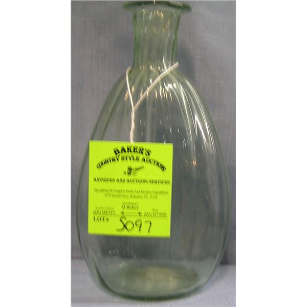 Antique greenish glass decanter with fluted top