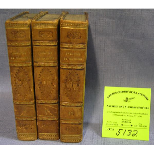 Group of three antique leather bound books