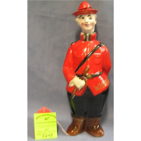 Figural Canadian mounted policeman liquor decanter