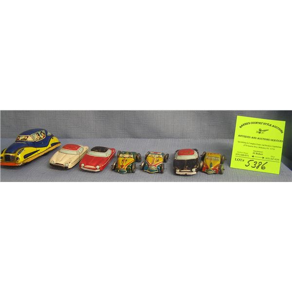 Group of seven vintage all tin vehicles