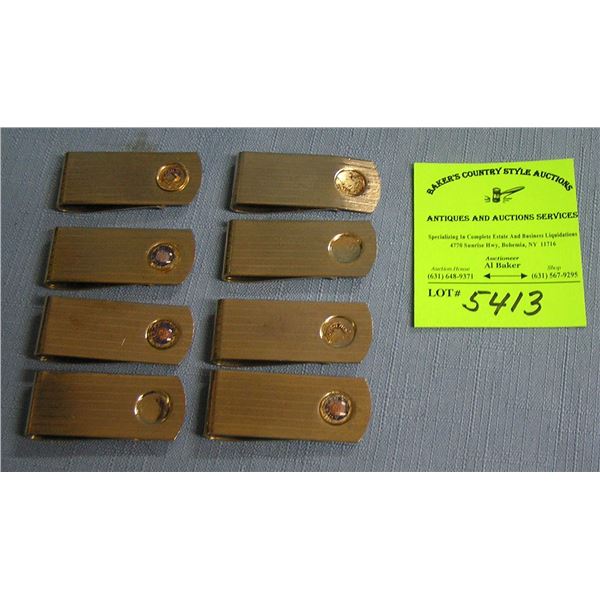 Group of gold plated money clips