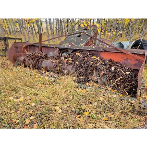 Combine header full of tire chains