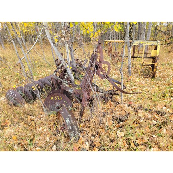 Old tiller, scrap steel & steel platform