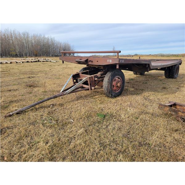 Approx. 24 ft x 9 ft  hay trailer, c/w single 9.00x20 frt rubber & 10.00x20 rear rubber, will hold 1