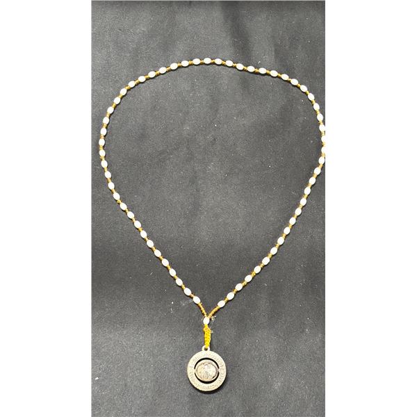 A ROTATING BALL PRAYER PENDANT