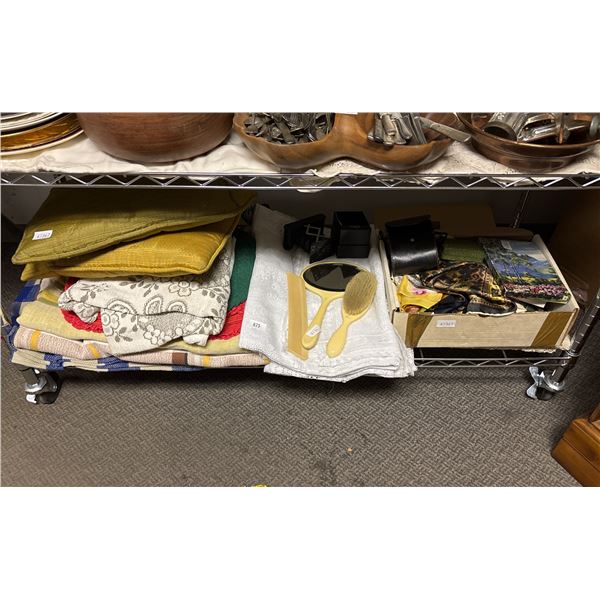 SHELF OF ASSORTED ITEMS INCLUDING; CUSHIONS, LINENS, HAIR BEAUTY SET & MORE