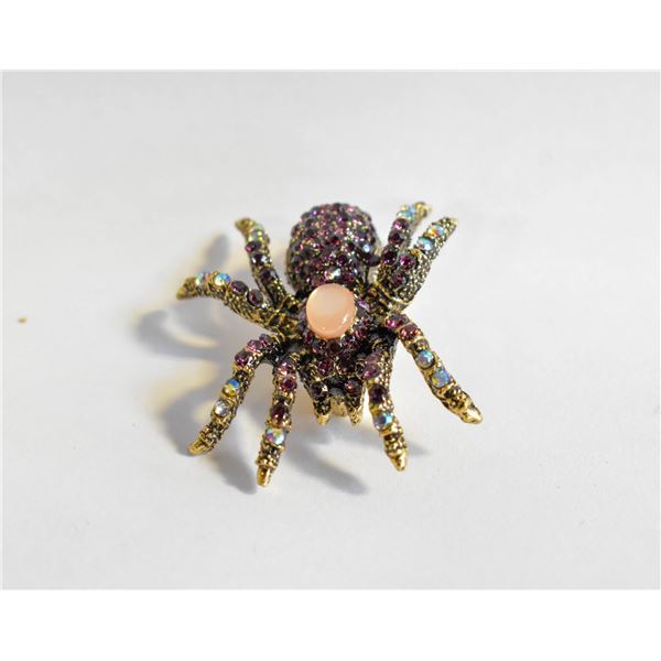 23)  GOLD TONE WITH PINK CRYSTALS & PALE